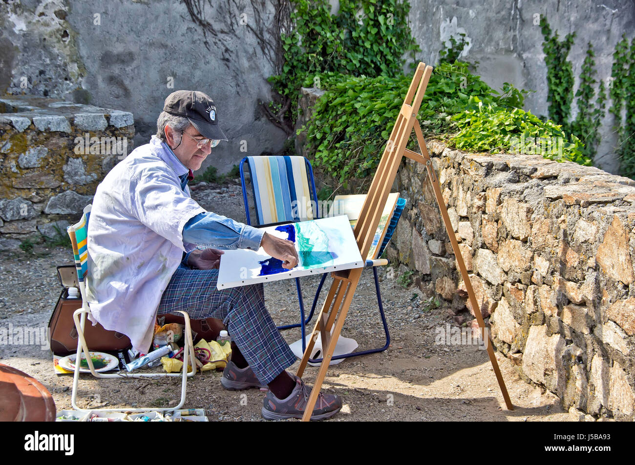 Artist painting a landscape at St. Tropez, France. Stock Photo