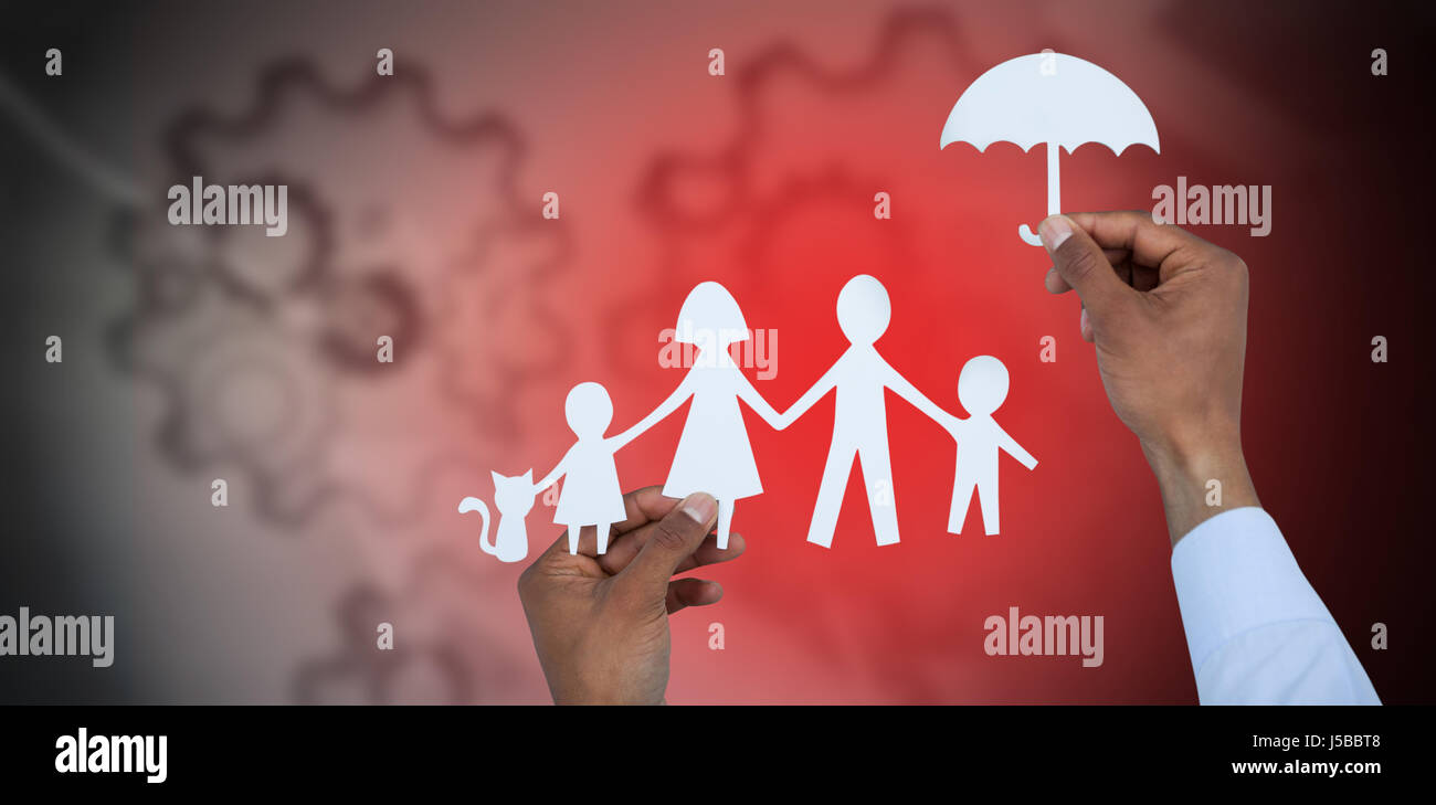 hand holding an umbrella and a family in paper against arrows with gears Stock Photo