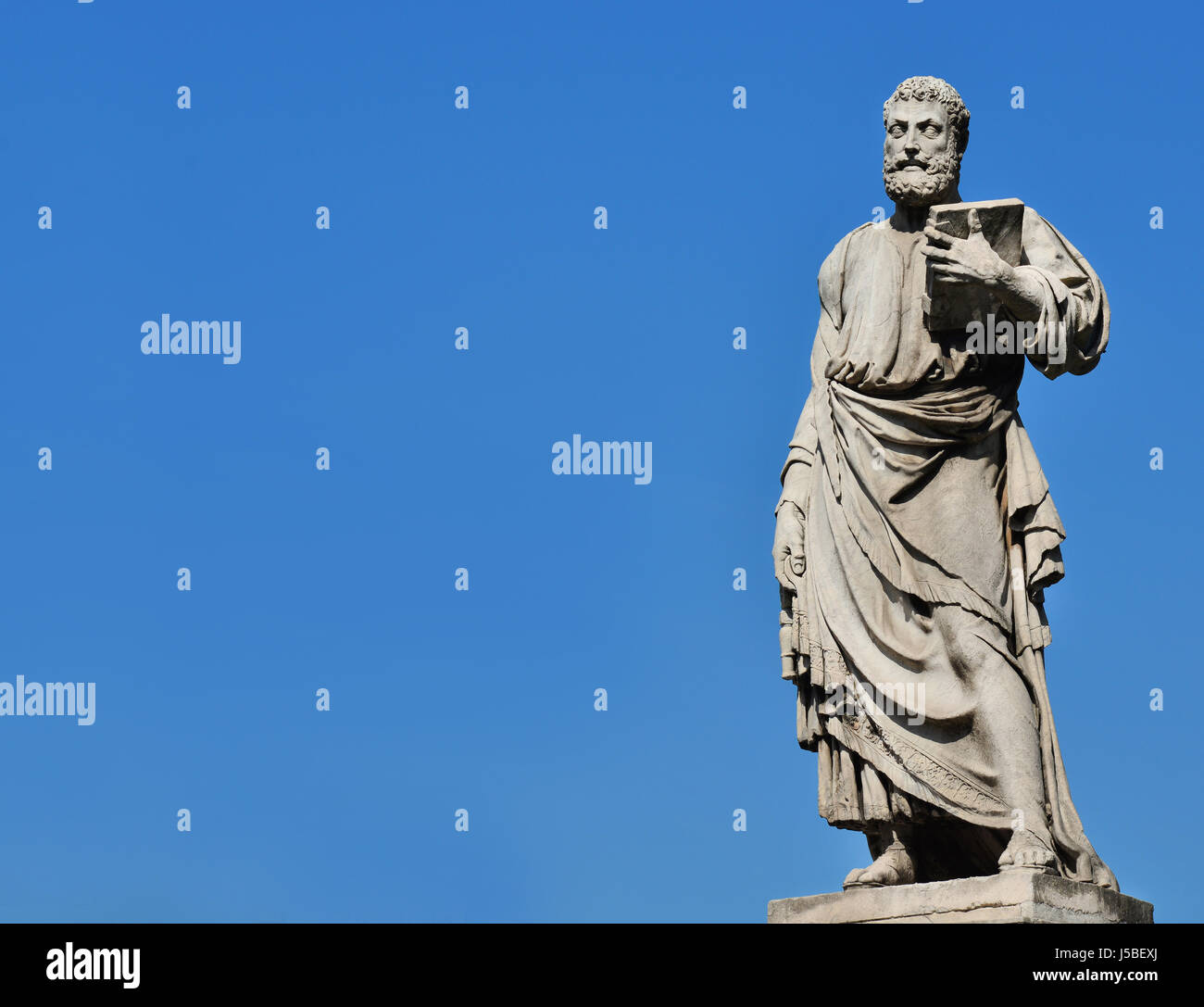 Saint Peter holding the key of heaven statue on Holy Angel Bridge in Rome, made in the 17th century by sculptor Lorenzetto (with copy space) Stock Photo