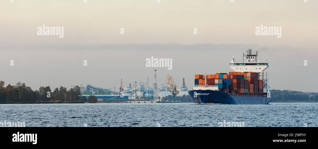 Blue container ship moving to Baltic sea. Riga, Latvia Stock Photo - Alamy