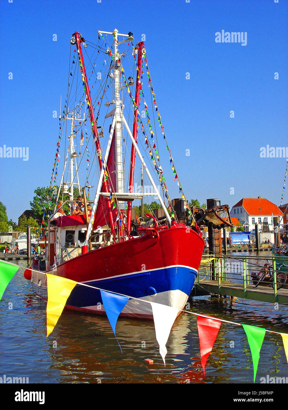 boat with colorful flags Stock Photo Alamy