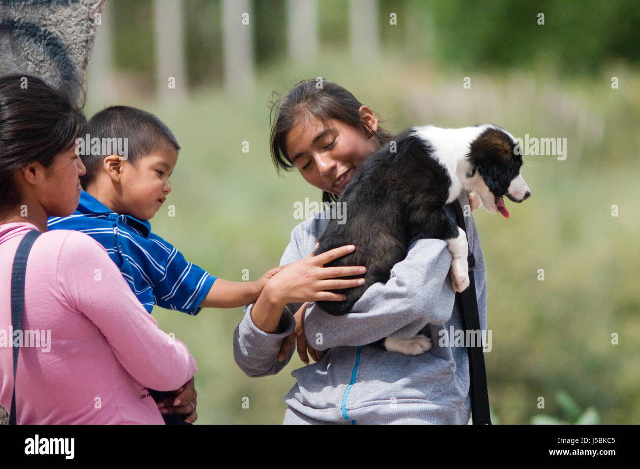 Aboriginal family with a puppy Stock Photo