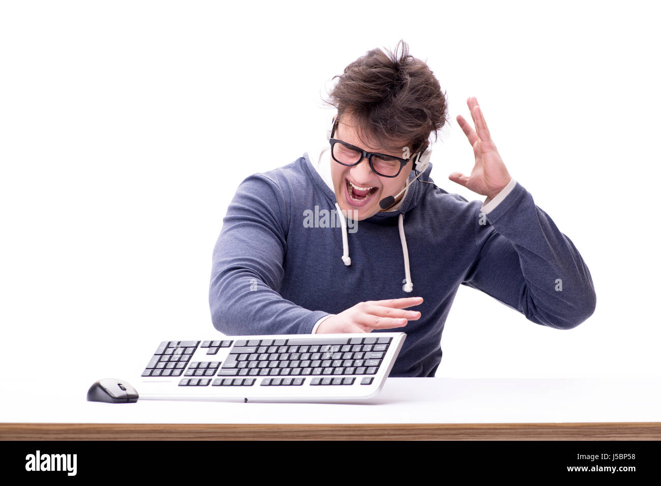 Funny nerd man working on computer isolated on white Stock Photo