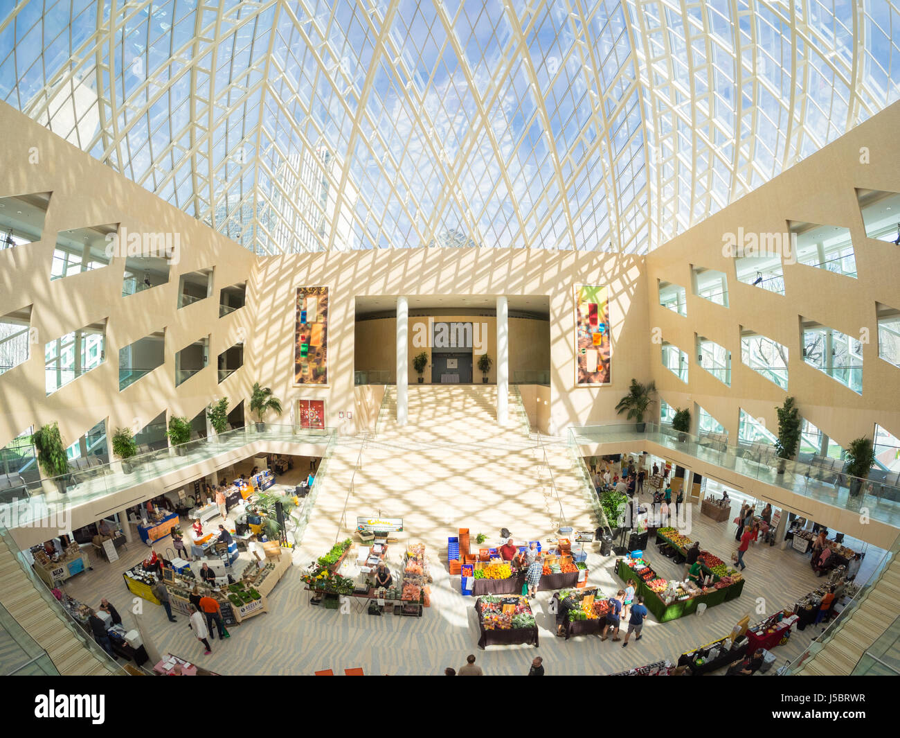 A wide angle, fish-eye view of the City Market (City Farmers' Market) and atrium interior of Edmonton City Hall in Edmonton, Alberta, Canada. Stock Photo