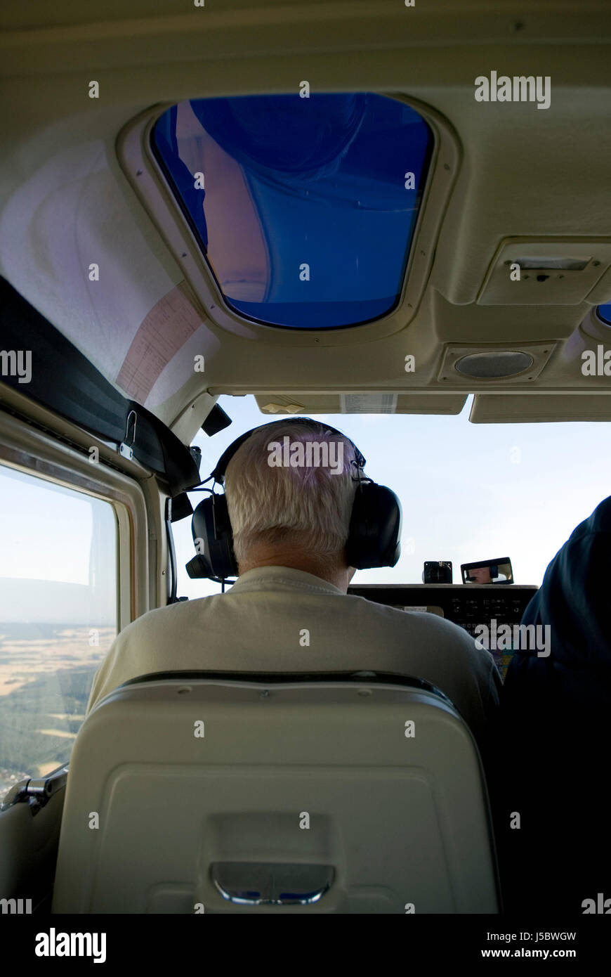 flight pilot portrait format earphones headphones aircraft aeroplane plane Stock Photo