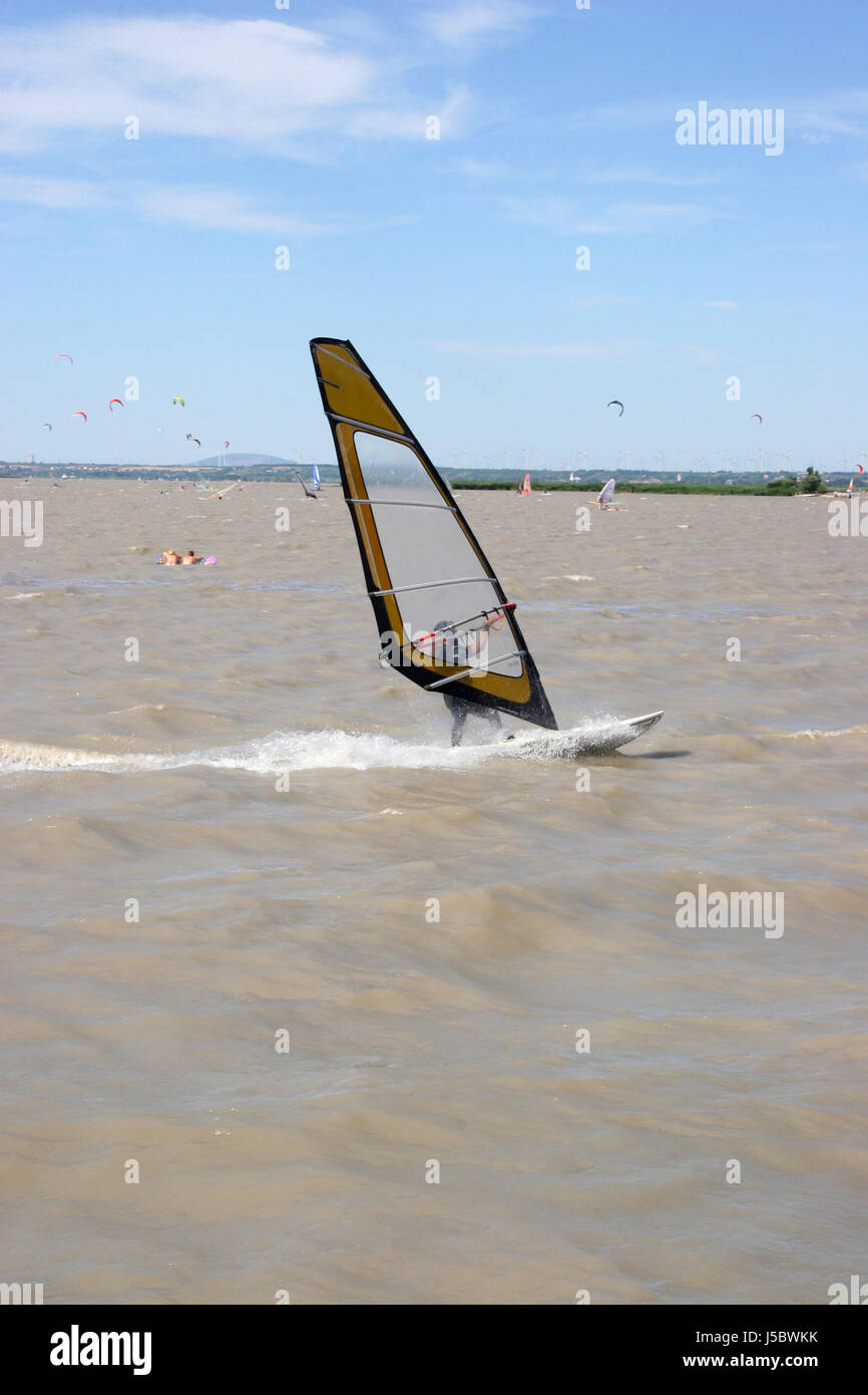 blue sport sports austrians parachutes firmament sky salt water sea ocean water Stock Photo