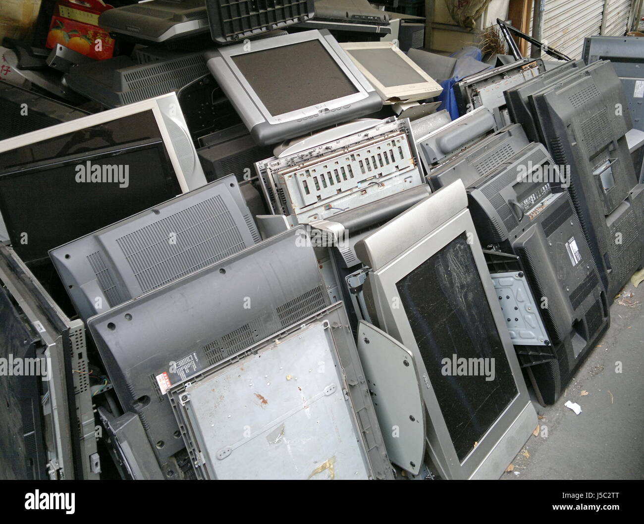 KAOHSIUNG, TAIWAN -- MAY 13, 2017: Stacks of old flat panel televisions are waiting to be shipped to recycling plant. Stock Photo