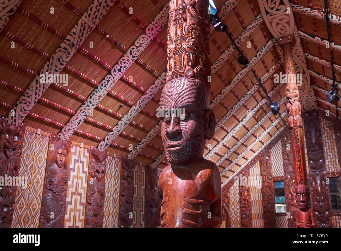 Maori meeting house with traditional carved interior, the national marae at the Waitangi Treaty Grounds in New Zealand Stock Photo