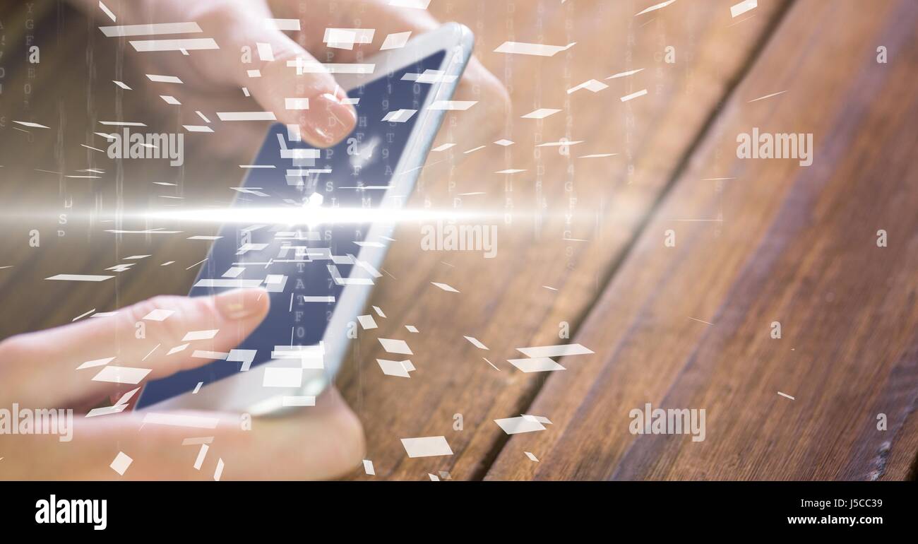 Digital composite of Hands using device with overlay Stock Photo - Alamy