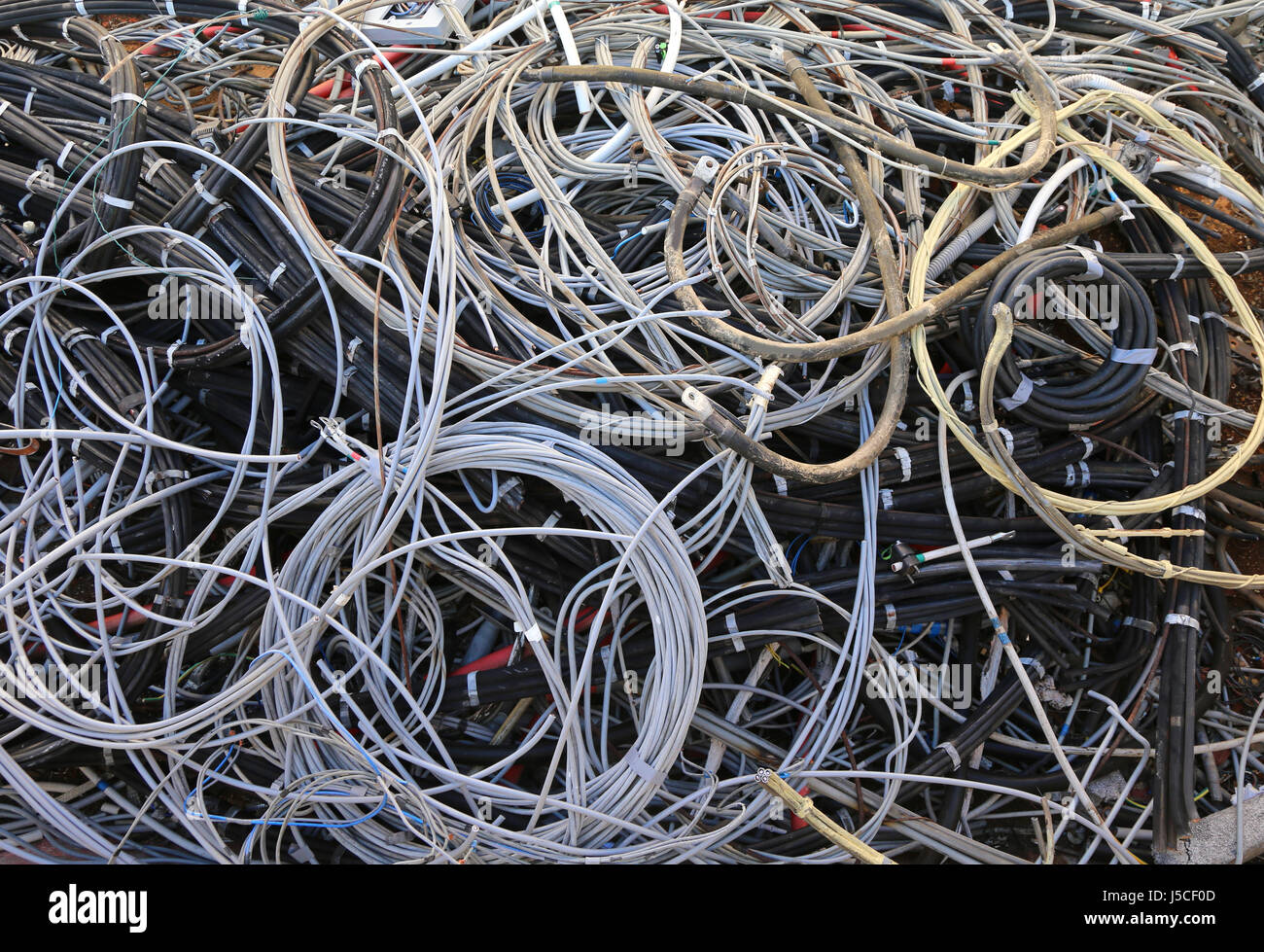 used electrical cables in the landfill for recyclable materials Stock