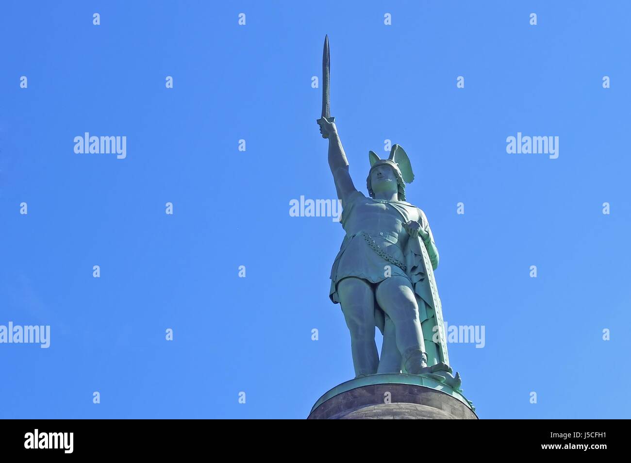 green statue sculpture attraction sword arm weapon firmament sky unclouded Stock Photo Alamy