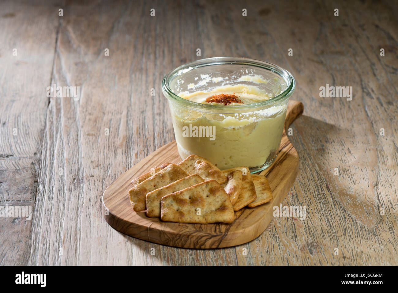 hummus or houmous middle eastern with Biscuits. Stock Photo