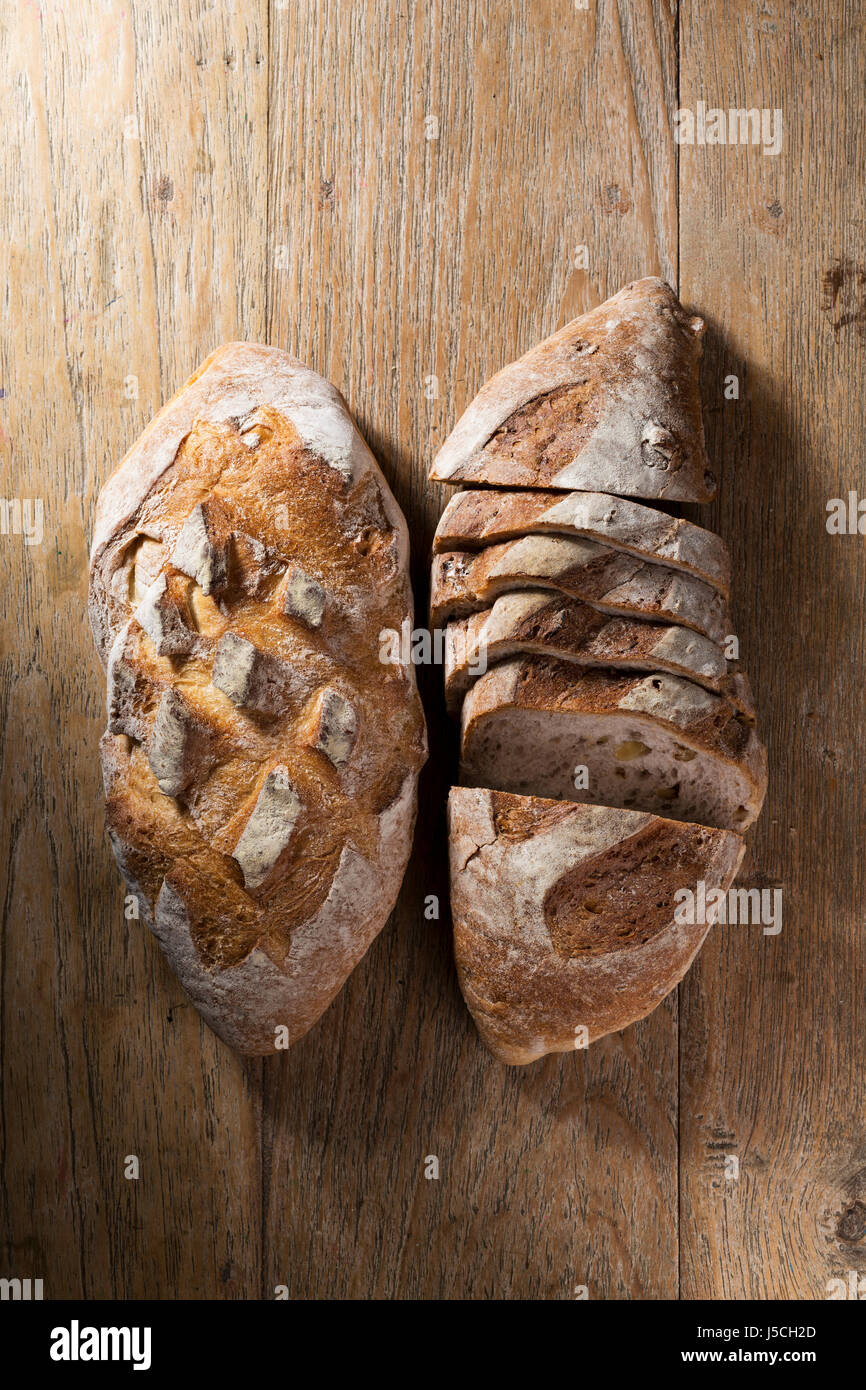 Above view of two rustic loafs of bread on an old wooden table Stock ...