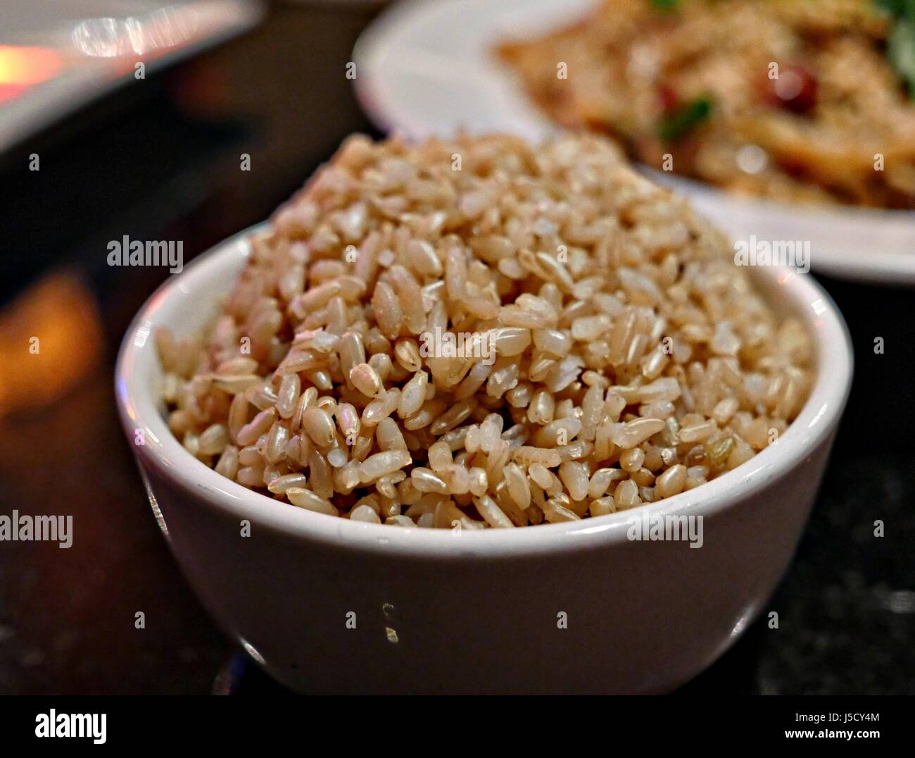 Cooked brown rice A bowl of long grained, steamed brown rice Stock ...
