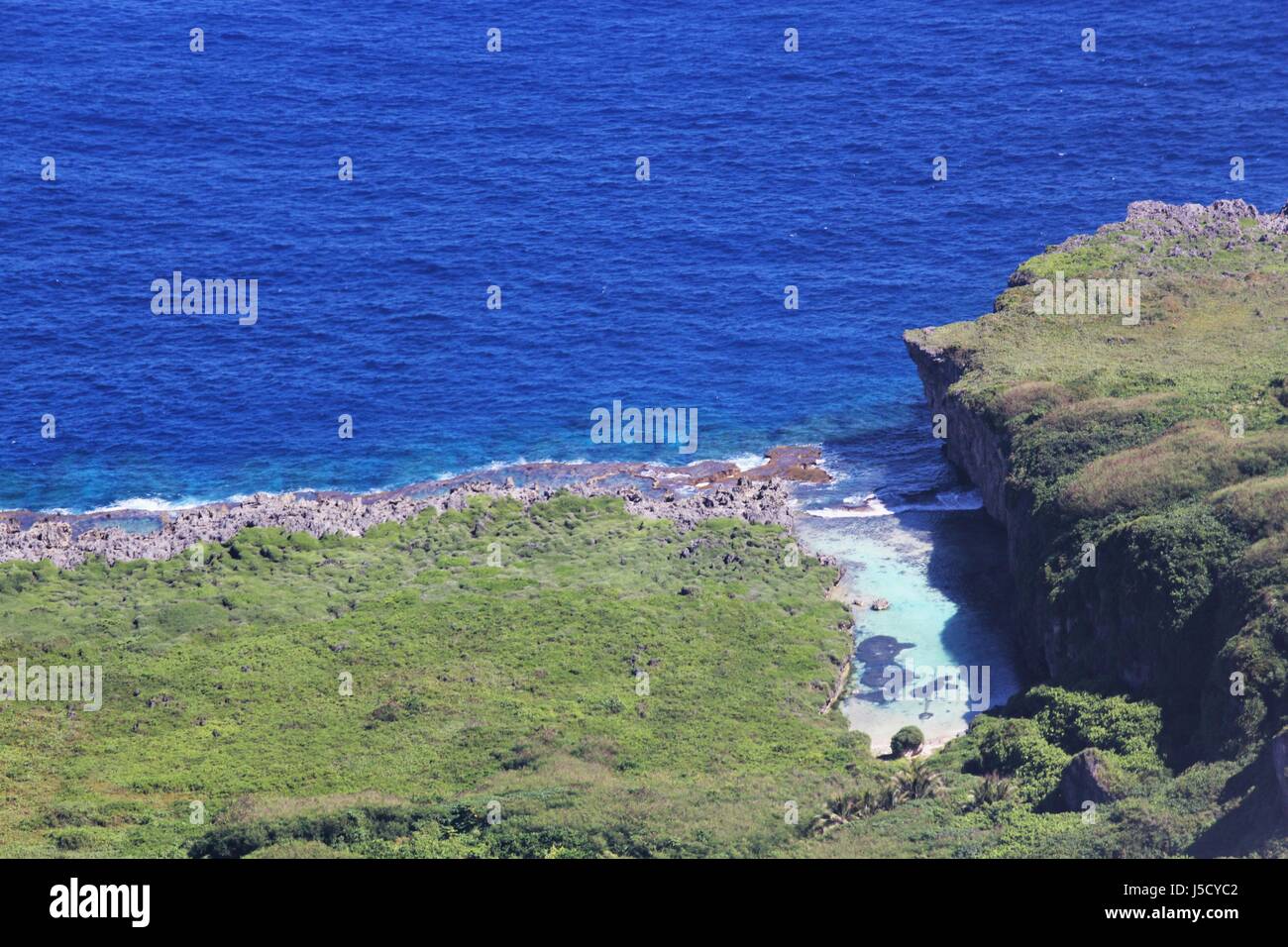 Aerial view of a hidden strip of water inlet in the North Field, Tinian, Northern Mariana Islands Stock Photo