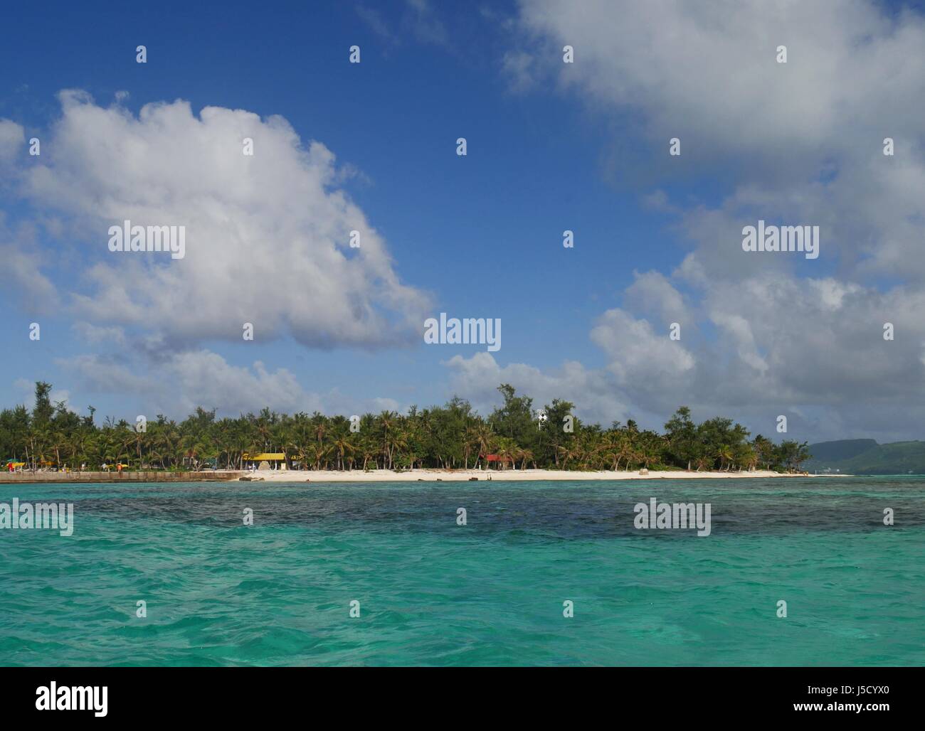 Picture-perfect clouds hover above Managaha Island, Saipan Stock Photo