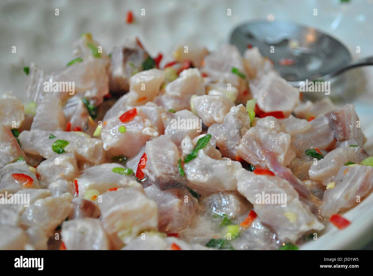 Fish kinilaw or raw fish cubes flavored with coconut vinegar and spices is a favorite dish in
