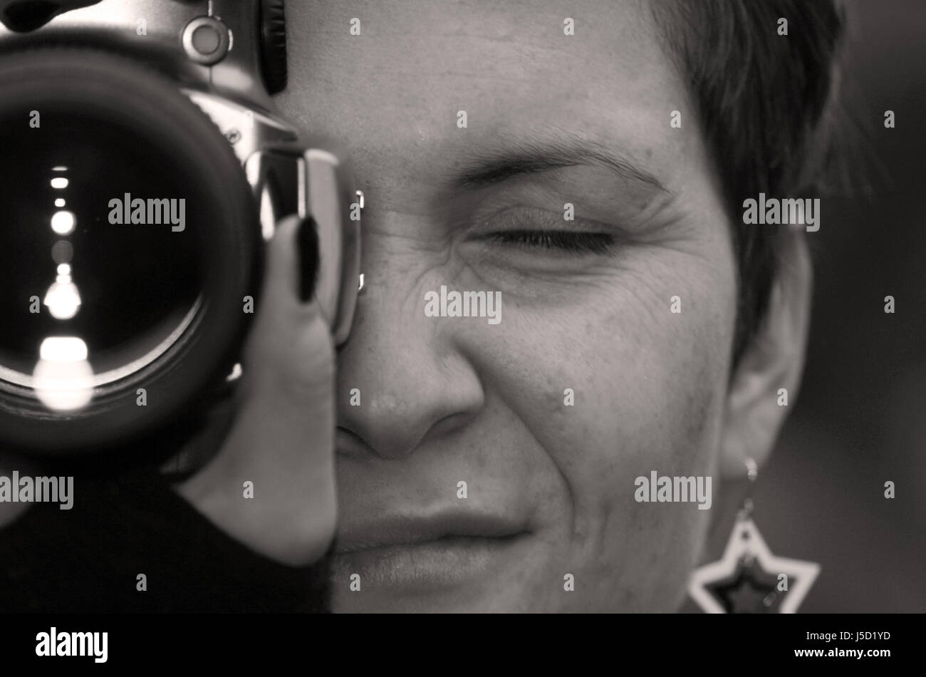 woman women face portrait eye organ skin bw photo camera earring ear rings Stock Photo