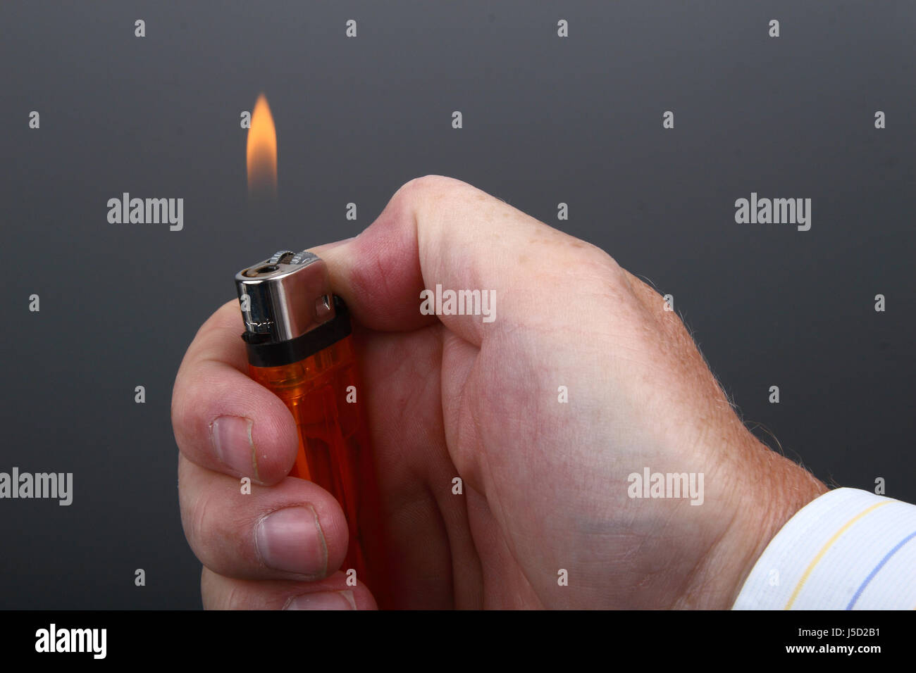 hand with lighter Stock Photo Alamy