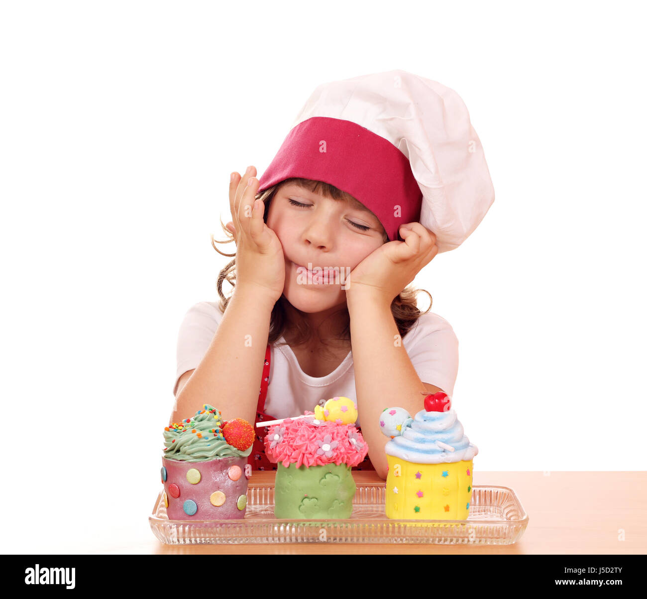 little girl cook enjoying sweet cupcakes Stock Photo Alamy