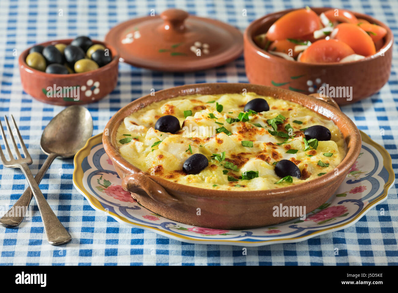 Bacalhau com natas. Portuguese salt cod with potatoes and cream