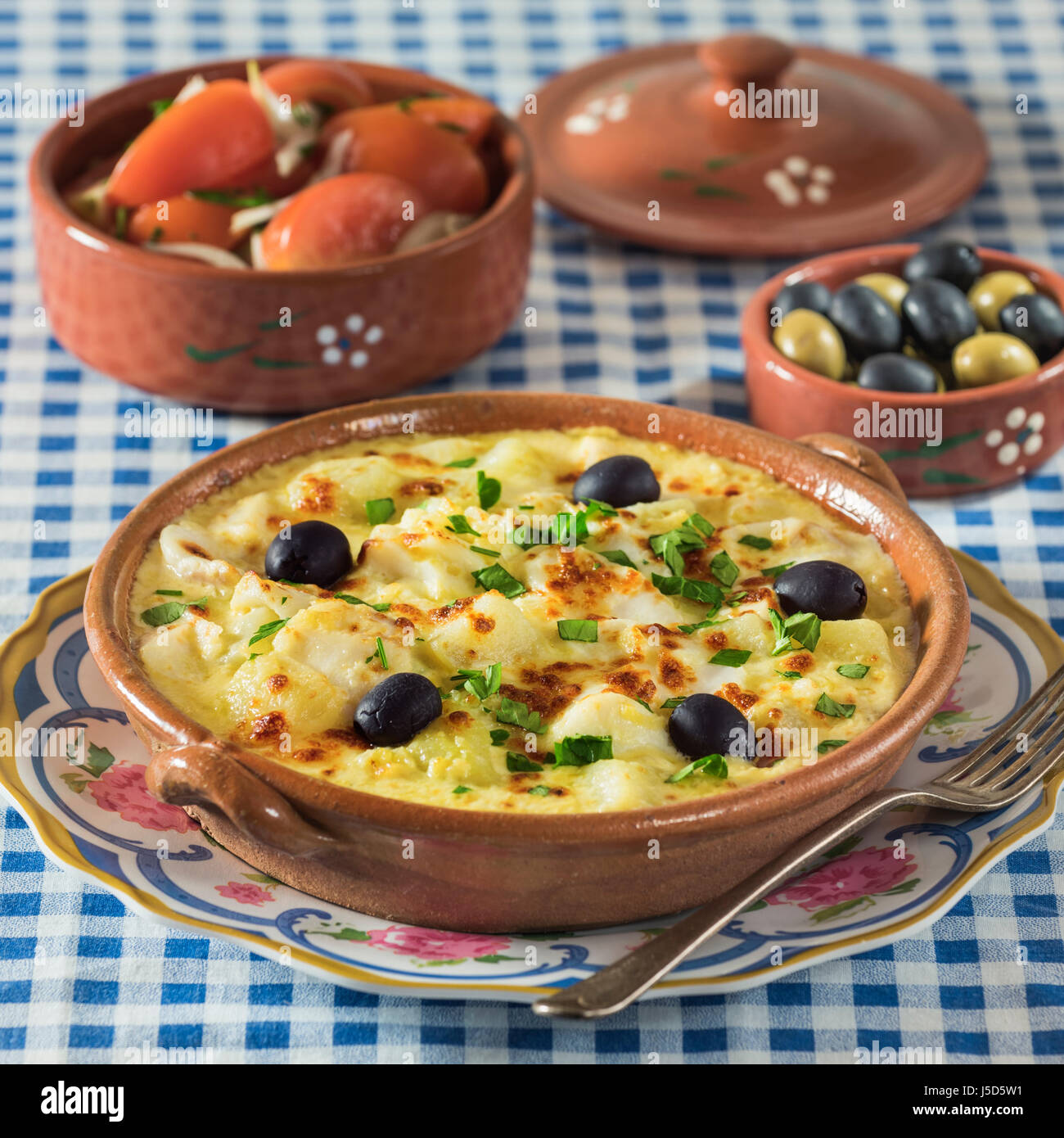 Bacalhau com natas. Portuguese salt cod with potatoes and cream