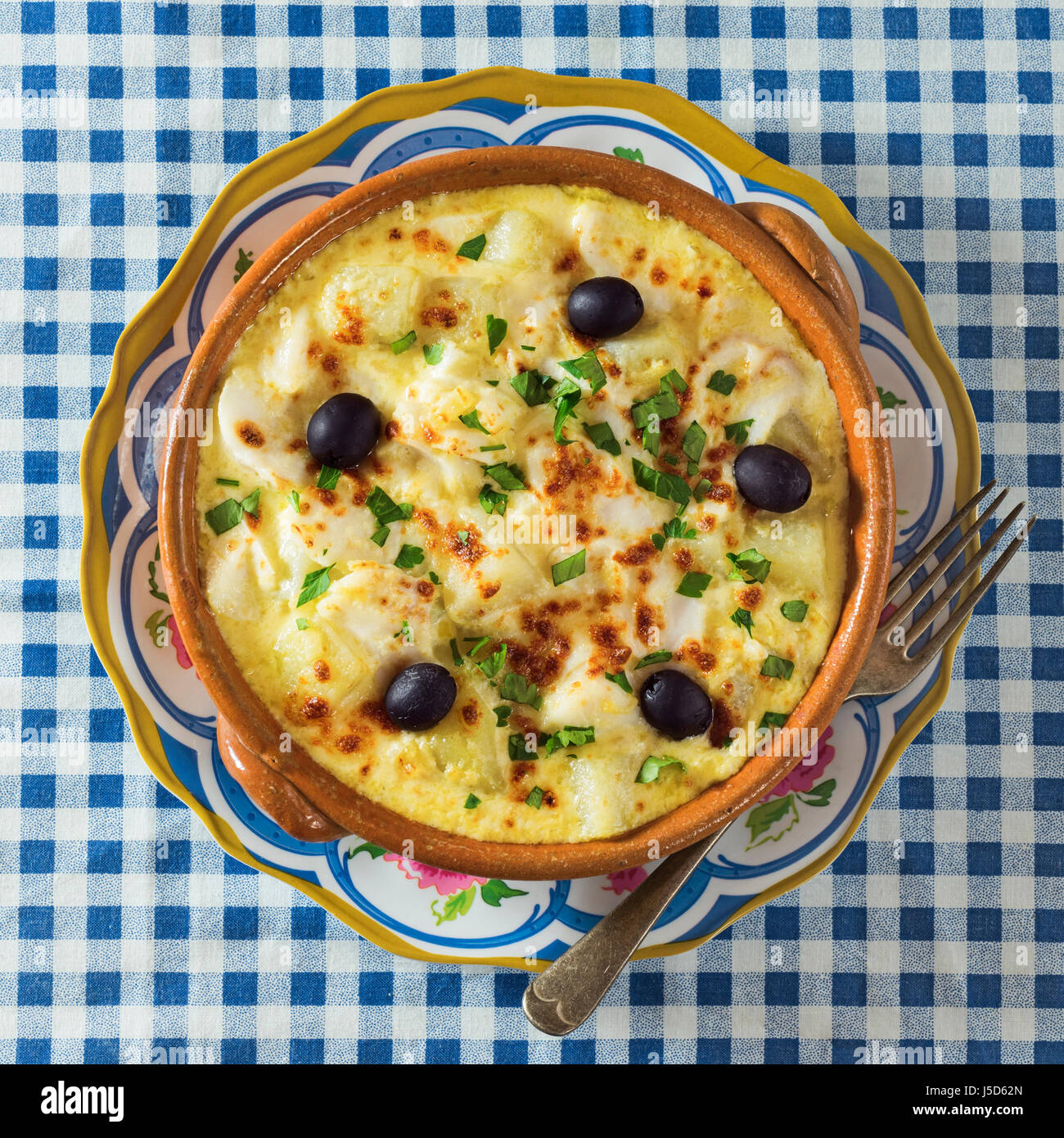 Bacalhau com natas. Portuguese salt cod with potatoes and cream