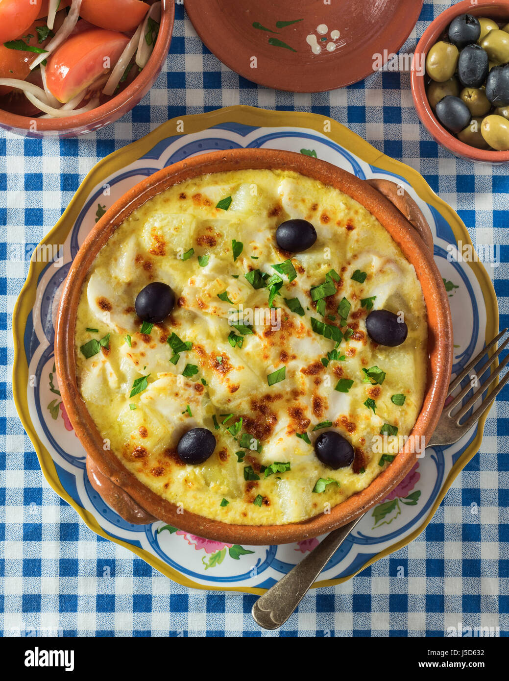 Bacalhau com natas. Portuguese salt cod with potatoes and cream