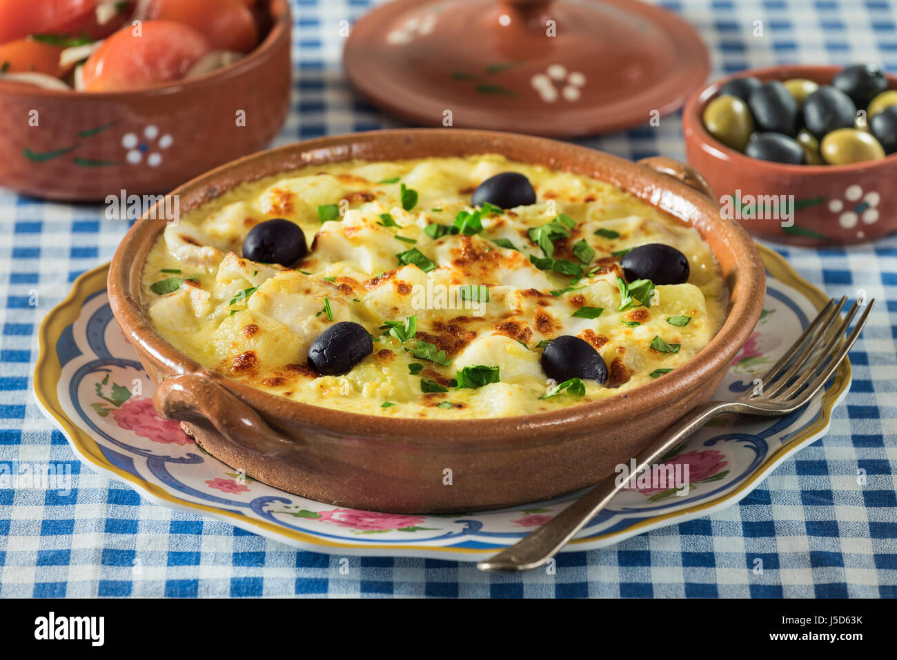Bacalhau com natas. Portuguese salt cod with potatoes and cream