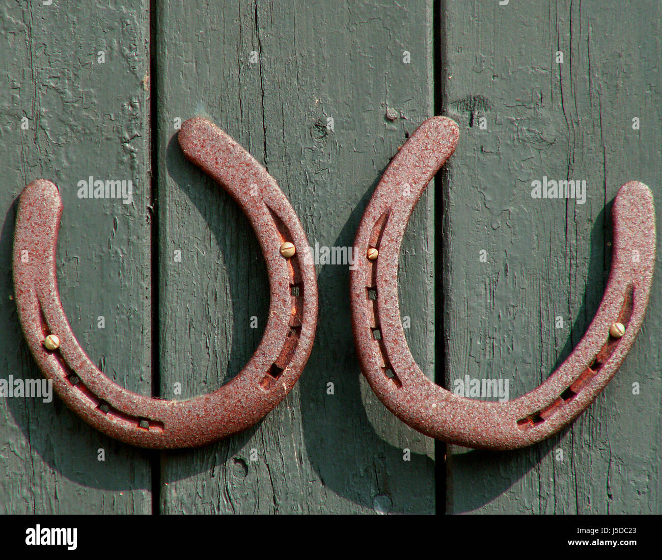iron duo rusty rust horseshoe double nailed on lucky luck two glcksbringer Stock Photo