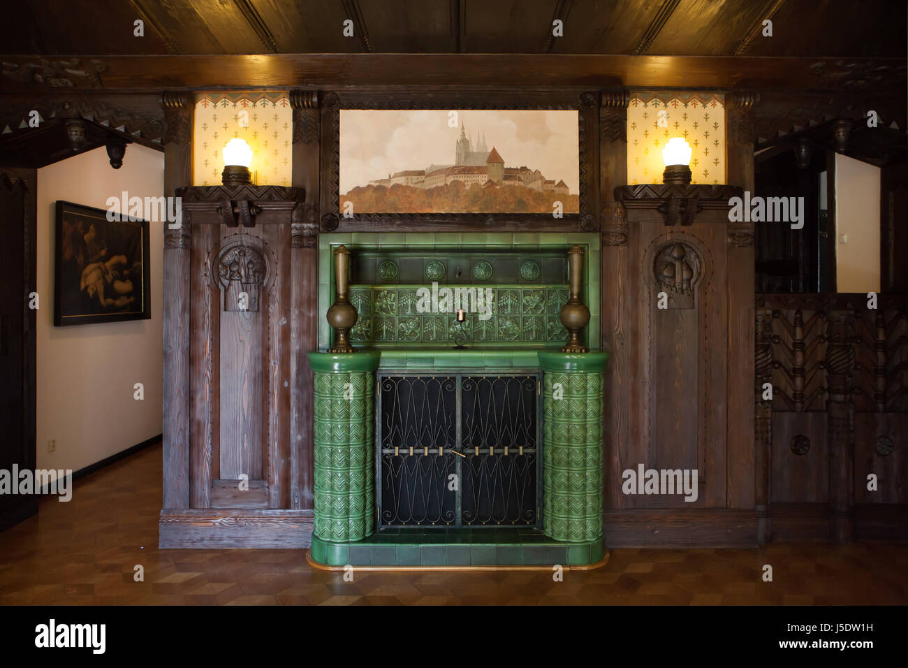 Majolica fireplace in the former billiard room of the Villa Kramář (Kramářova vila) in Prague, Czech Republic. The villa designed by Austrian architect Friedrich Ohmann was built 1911-1914 for Czech politician Karel Kramář and his Russian wife Nadezhda Kramář, née Khludova. The billiard room was decorated in Russian style. The building is now served as the official residence of the Prime Minister of the Czech Republic. Stock Photo