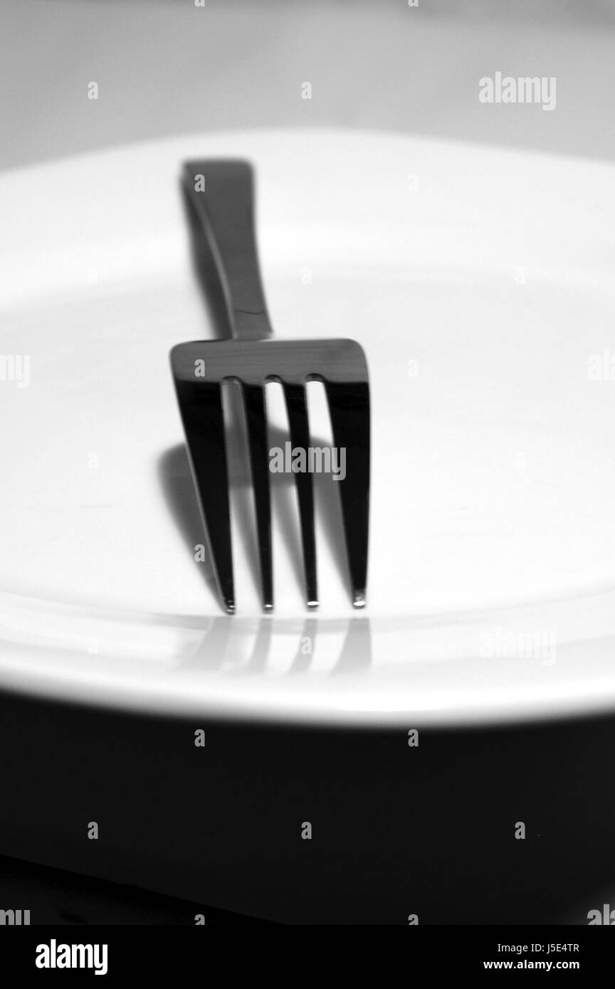bw black swarthy jetblack deep black plate fork eating eat eats dine dining Stock Photo