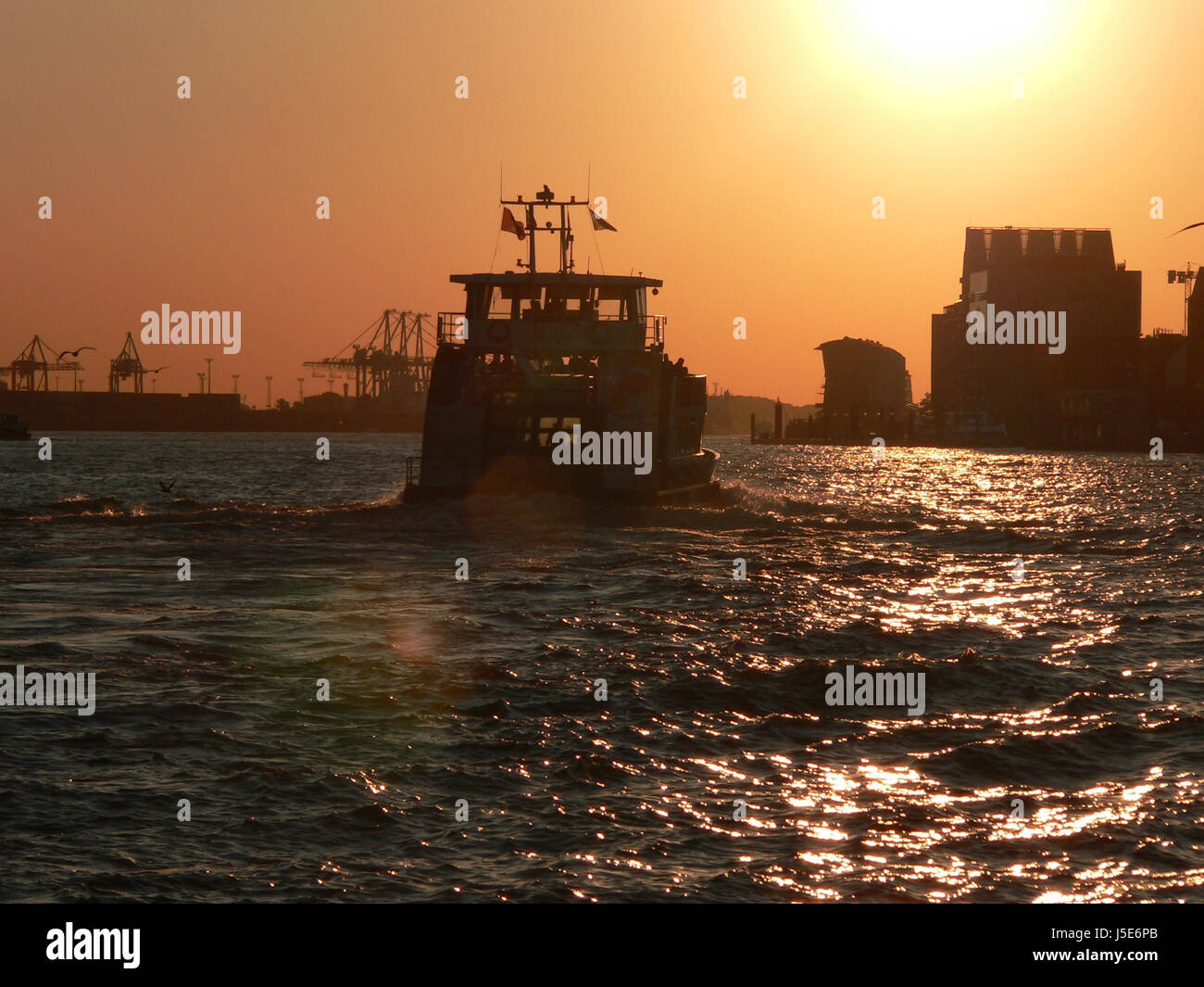 blue sunset sunrise mood evening harbor hamburg gangplanks harbours elbe orange Stock Photo