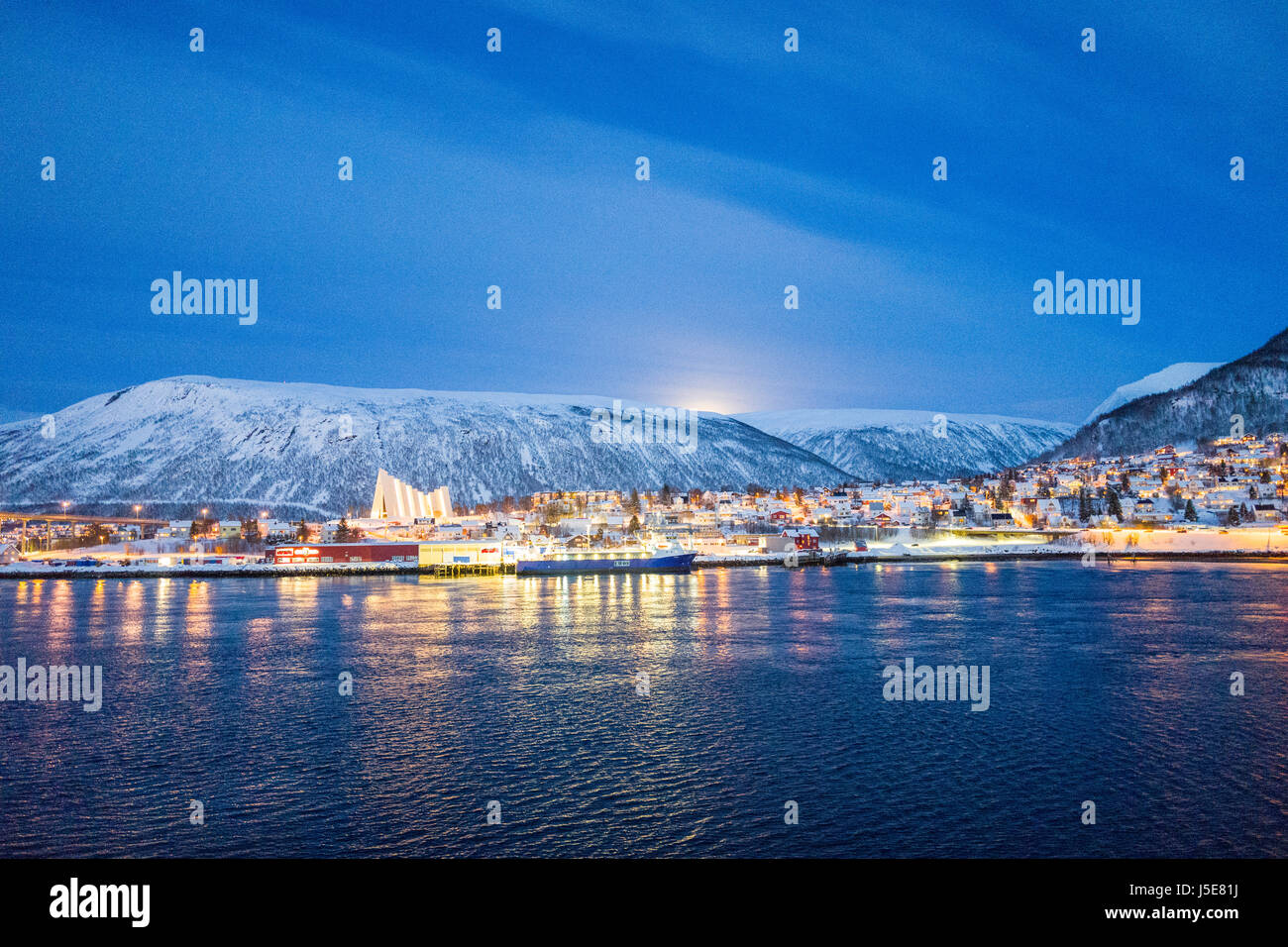 View towards the mainland area of Tromsdalen and the Arctic Cathedral, from the city center area of Tromsø, Norway, on the island of Tromsøya. Stock Photo