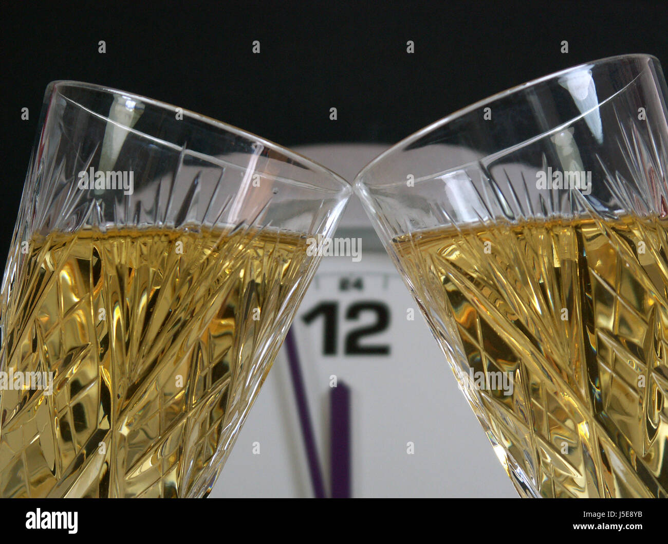 celebrate reveling revels celebrates clock party celebration cheers champagne Stock Photo