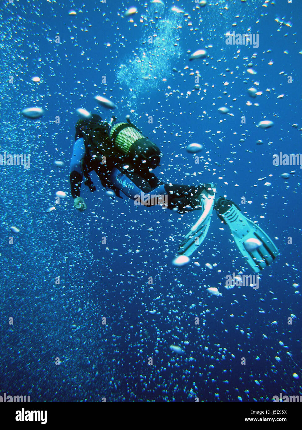 blue under dive diving sports salt water sea ocean water diver blue bubbles Stock Photo