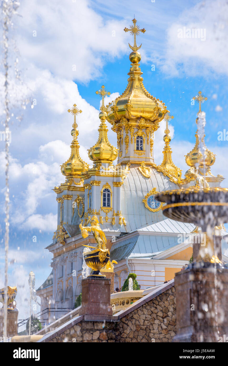 Fountain and church of the palace of Peterhof. St Petersburg, Russia Stock Photo