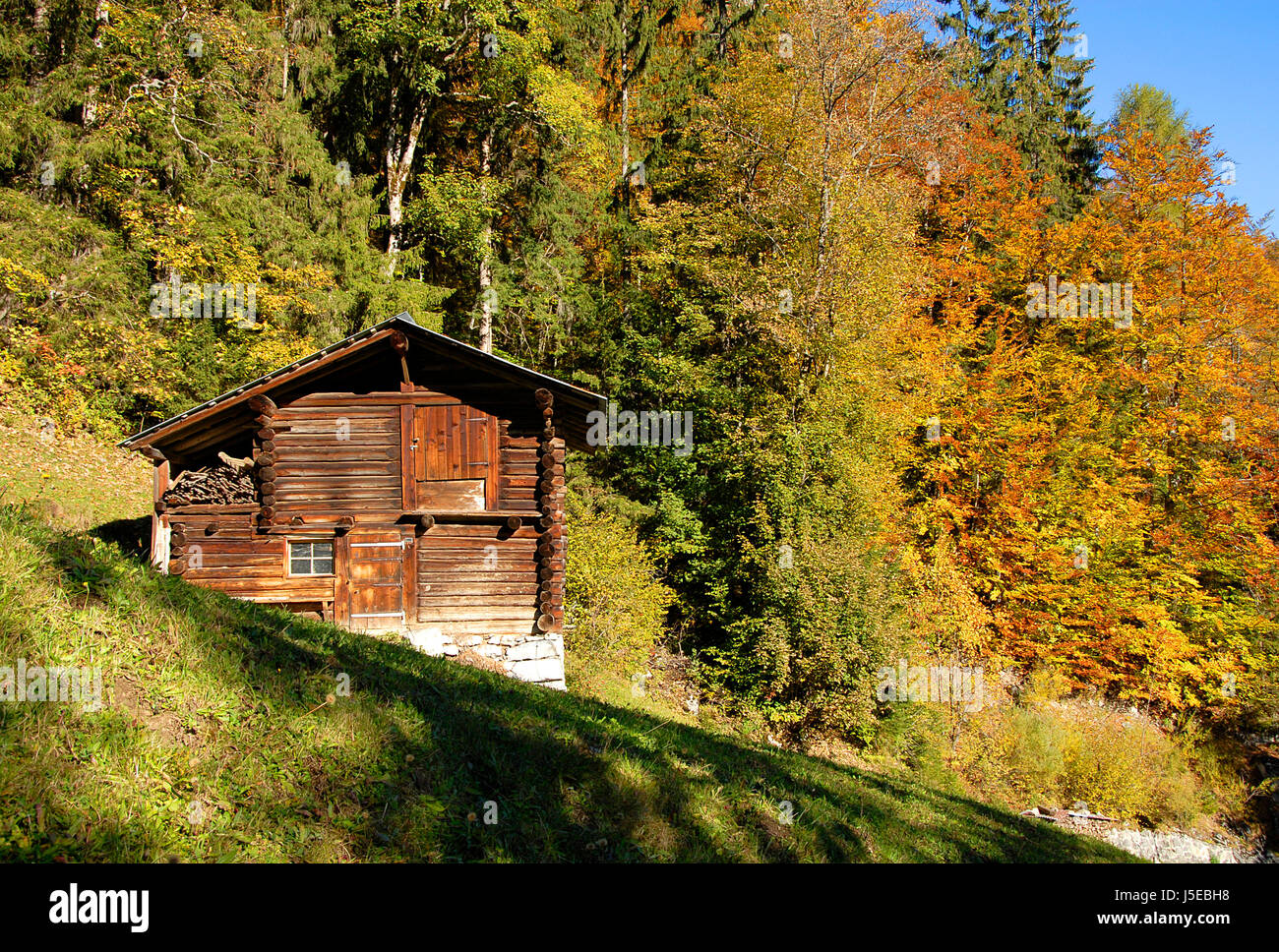 bucolic mountains agriculture farming alps loneliness peace farmhouse seclusion Stock Photo