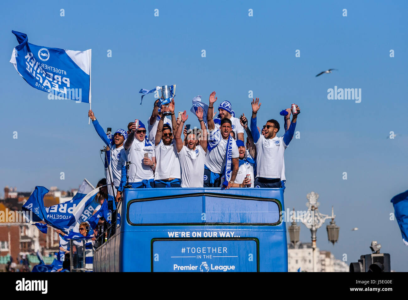 Players From Brighton and Hove Albion FC Take Part In An Open Top Bus Parade To Celebrate The Clubs Promotion To The Premier League, Brighton, UK Stock Photo