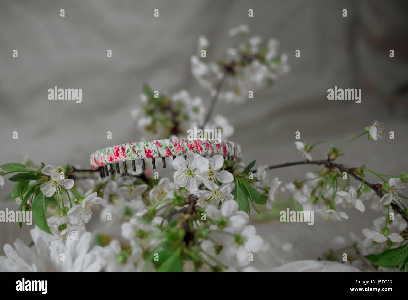 White wreath with cherry blossom. Flower crown Stock Photo