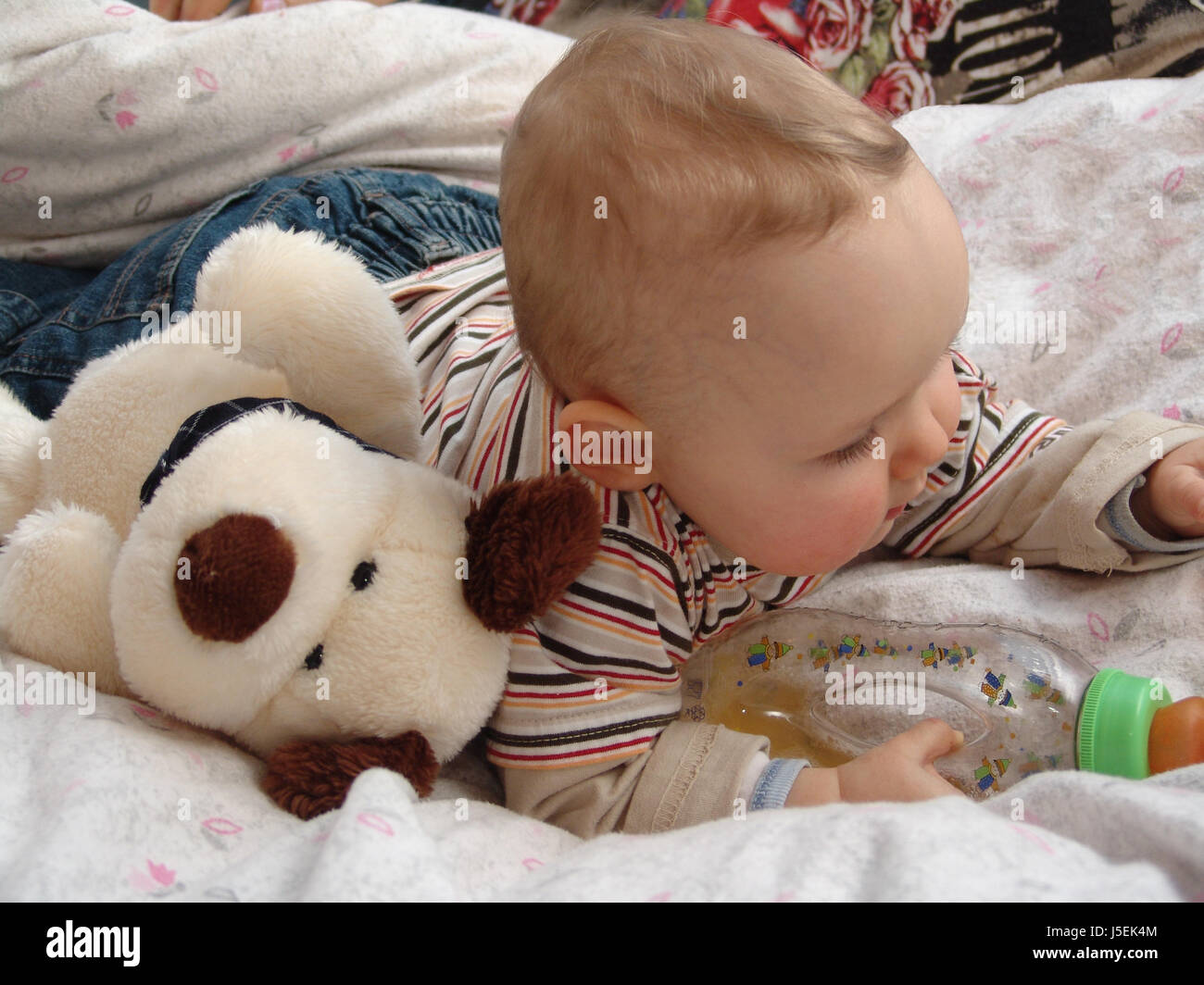 game tournament play playing plays played bed curiosity curious nosey nosy baby Stock Photo
