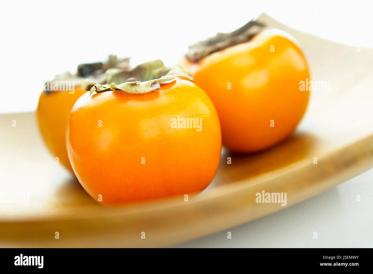 Sharon fruit, Persimmon, Orange subject Stock Photo - Alamy
