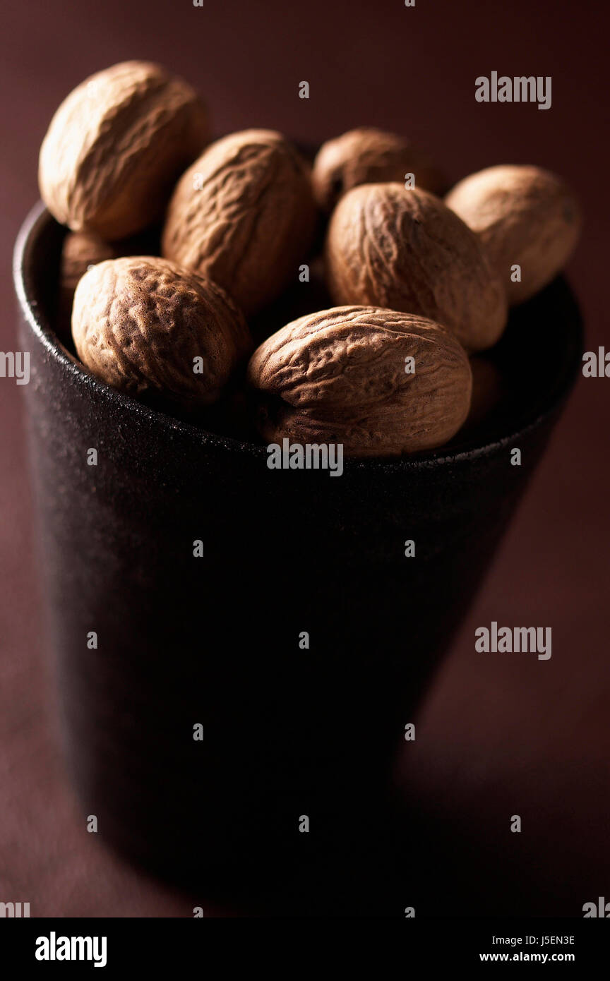 Nutmeg, Mace, Myristica fragrans, Mass of brown coloured spice in cup Stock Photo Alamy