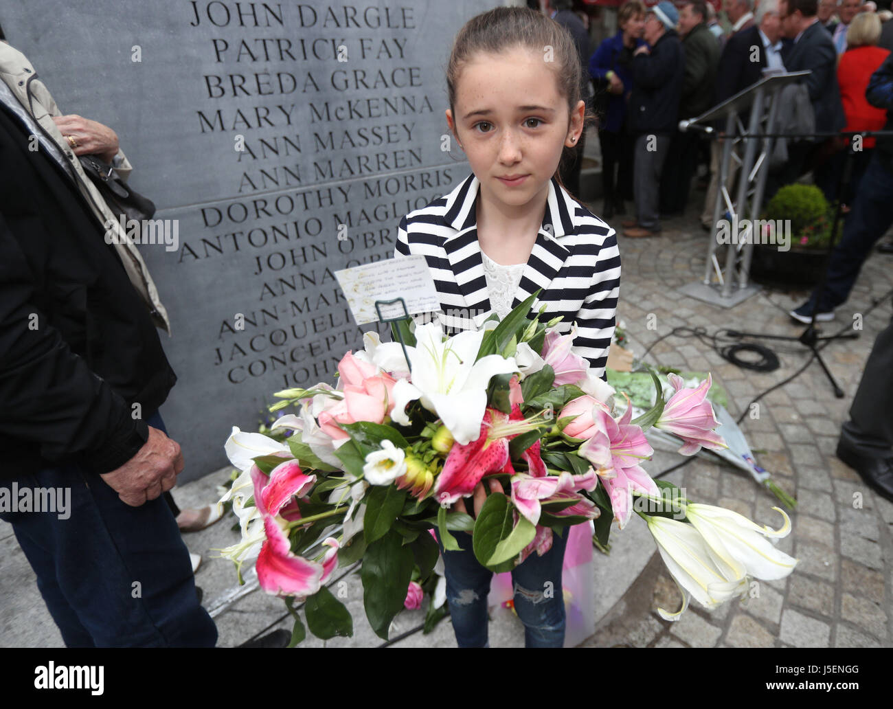 10-year-old Roseanna Grace, whose grandmother Breda Grace was killed in the Talbot Street bomb, holds a wreath during a memorial ceremony in Dublin's Talbot Street marking the anniversary of the bombings in Dublin and Monaghan on May 17 1974. Stock Photo