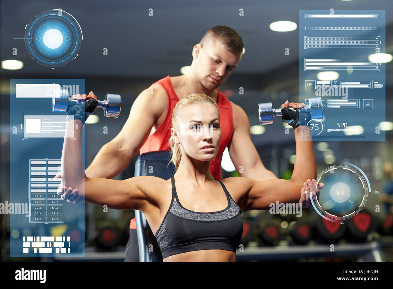 man and woman with dumbbells in gym Stock Photo - Alamy