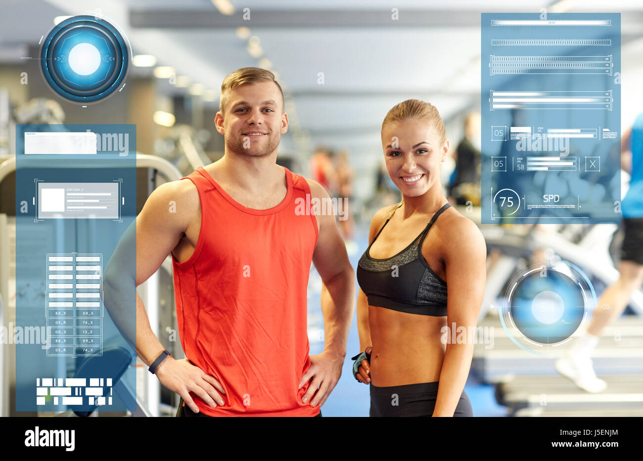 smiling man and woman in gym Stock Photo - Alamy