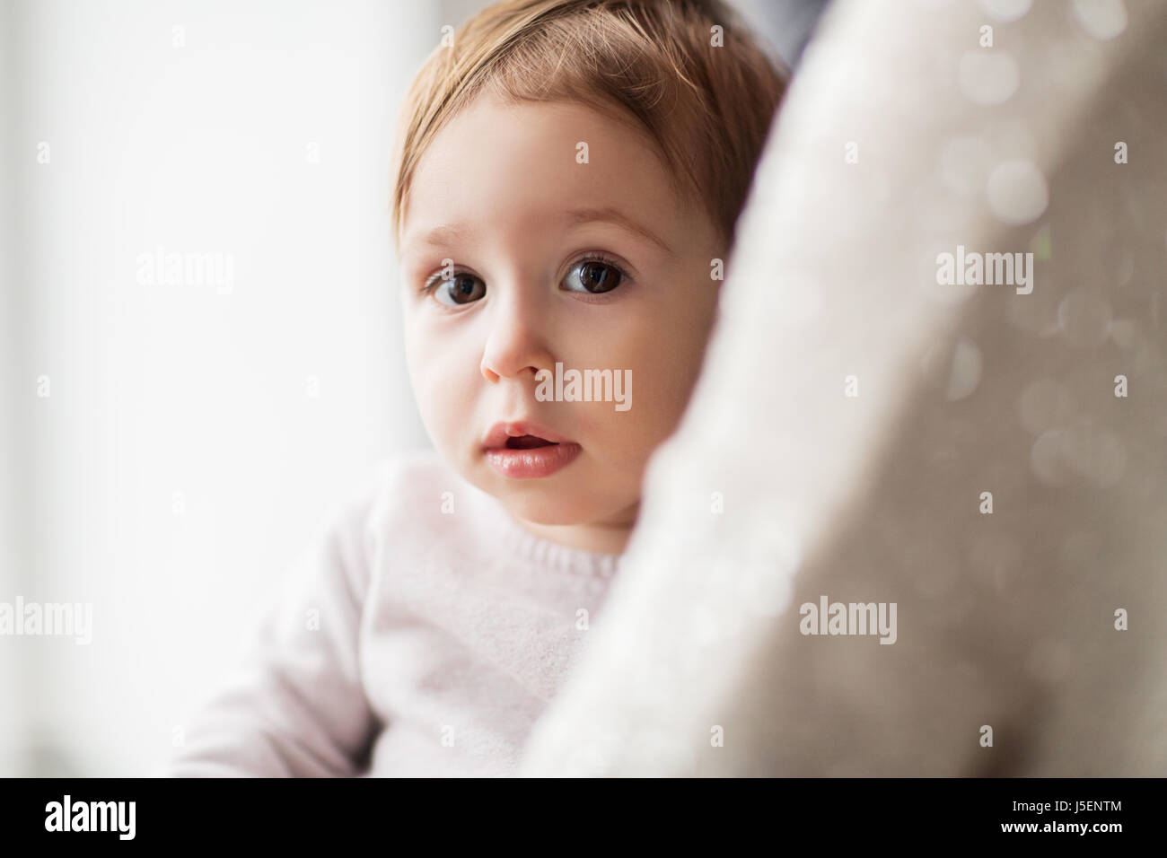 close up of sweet little baby girl with mother Stock Photo