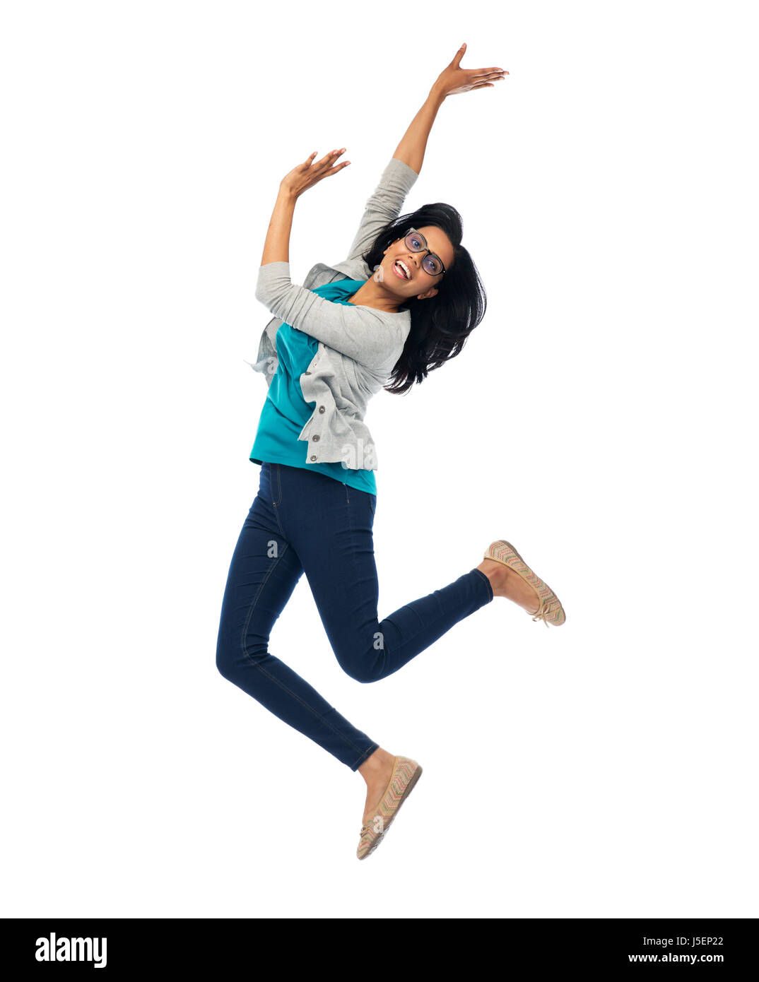 smiling young indian woman jumping in air Stock Photo Alamy