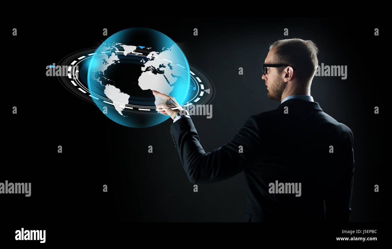 businessman with virtual earth projection Stock Photo