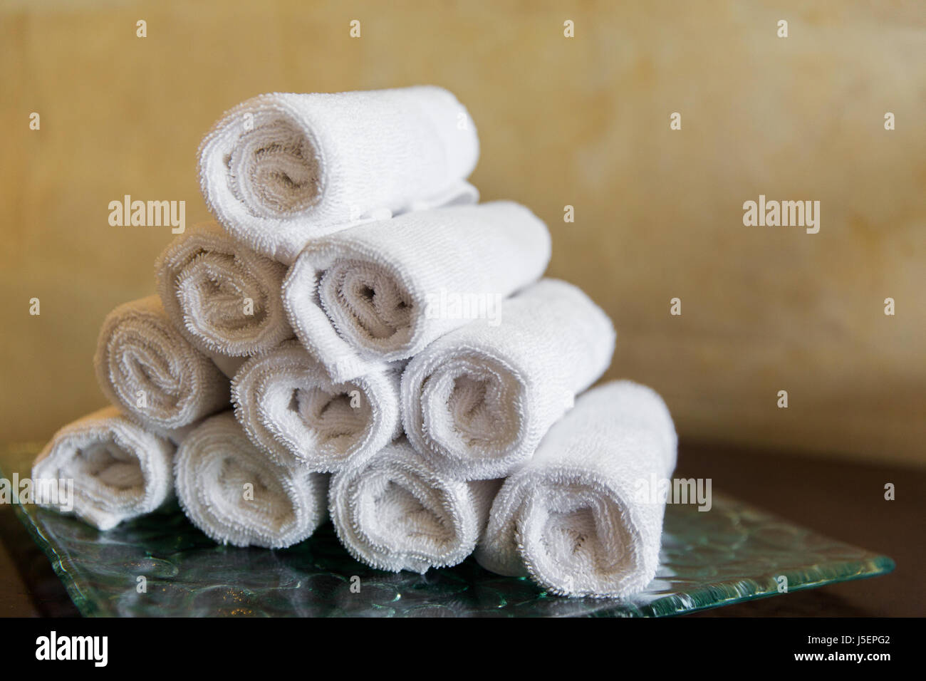 rolled bath towels at hotel spa Stock Photo Alamy